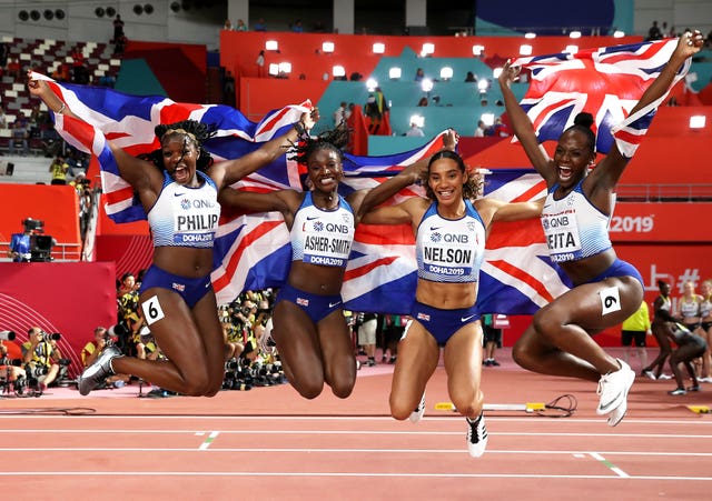 Asha Philip, Dina Asher-Smith, Ashleigh Nelson and Daryll Neita celebrate their 4x100m relay silver