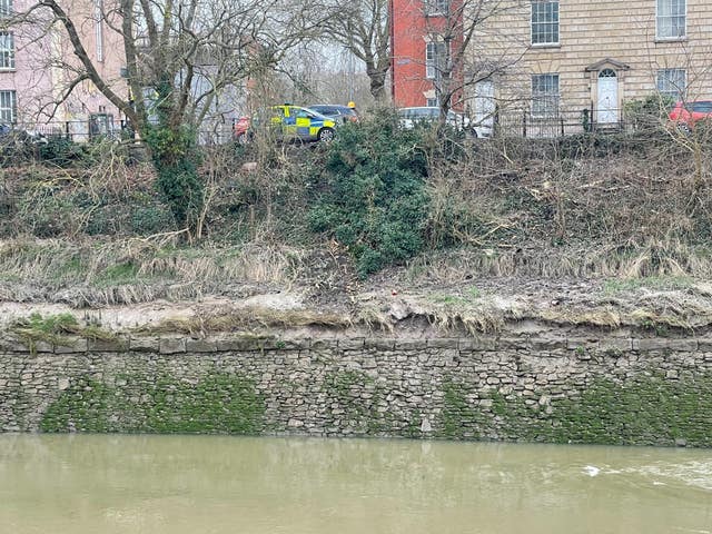 The scene in the Bedminster area of Bristol after a car drove through the gates and into the River Avon (Ben Birchall/PA)