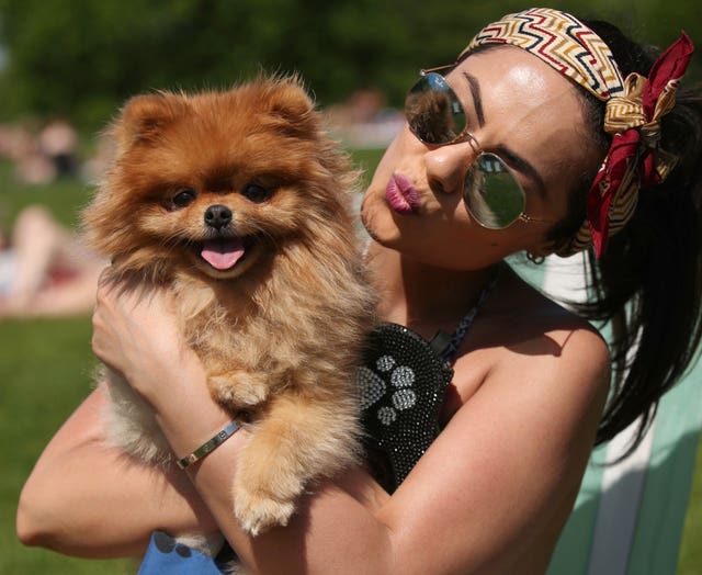 Mash Nas with her two-year-old Pomeranian Kookie in Hyde Park, London (Yui Mok/PA)