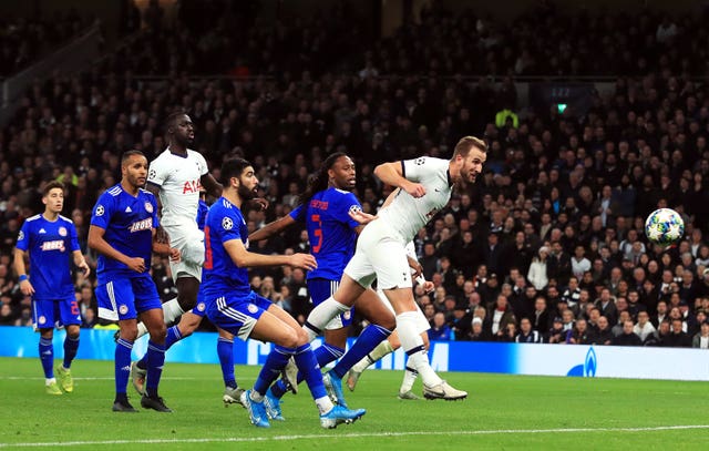 Harry Kane, right, scores his 20th Champions League goal, against Olympiakos in November 2019