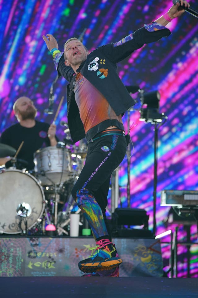 Coldplay singer Chris Martin dancing on stage
