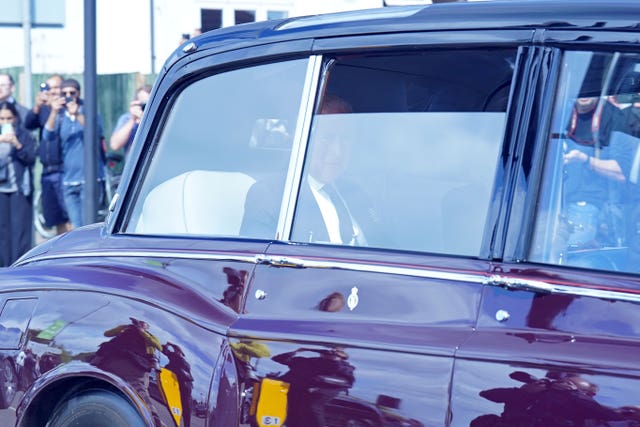 King Charles III and the Queen arriving at RAF Northolt in London 