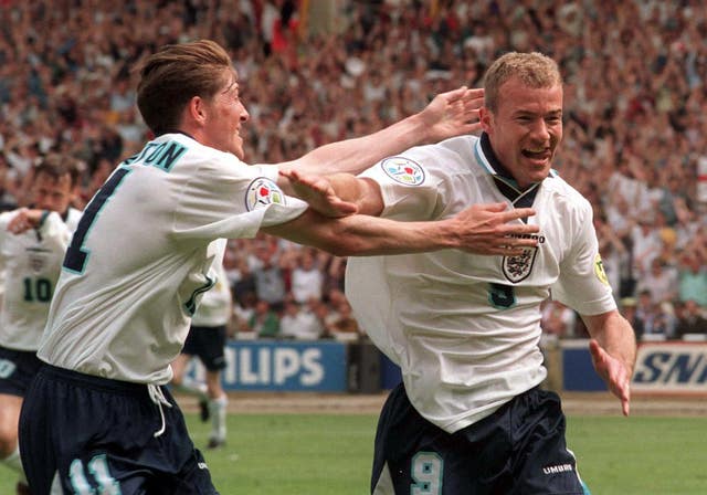 England's Darren Anderton runs to congratulate Alan Shearer after his opening goal in the Euro 96 match against Switzerland