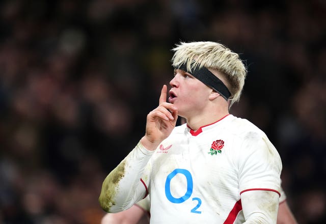 Henry Pollock celebrates scoring a try for England 