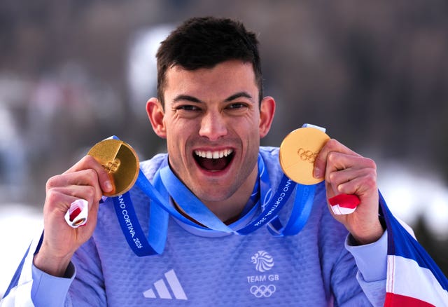 Matt Weston with his two gold medals