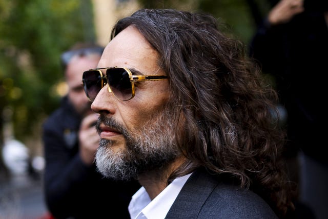 Russell Brand in shades outside court