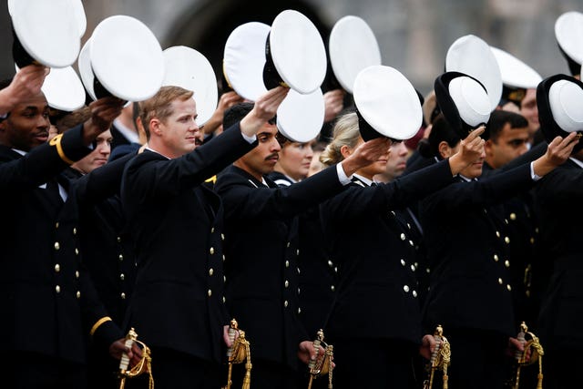 Officers raise their hats