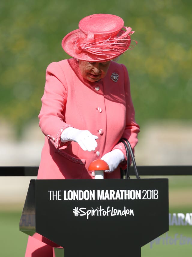 The Queen, at Windsor Castle, presses a button to start the 2018 London Marathon 