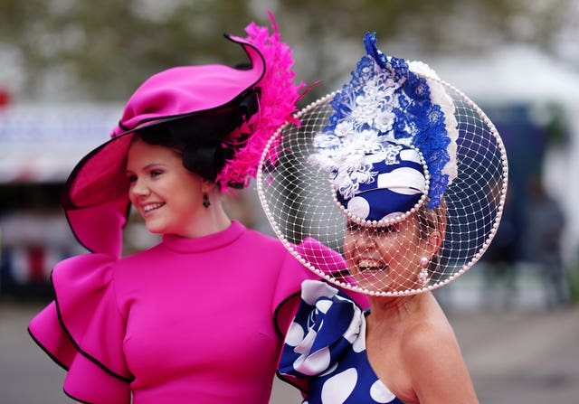 Racegoers on colourful hats