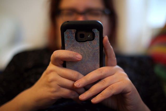 View of a woman using a smartphone