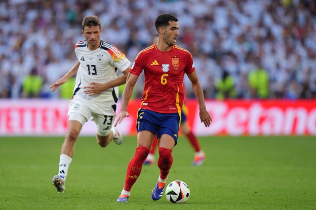 Mikel Merino turns away from Thomas Muller during Spion's Euro 2024 clash with Germany