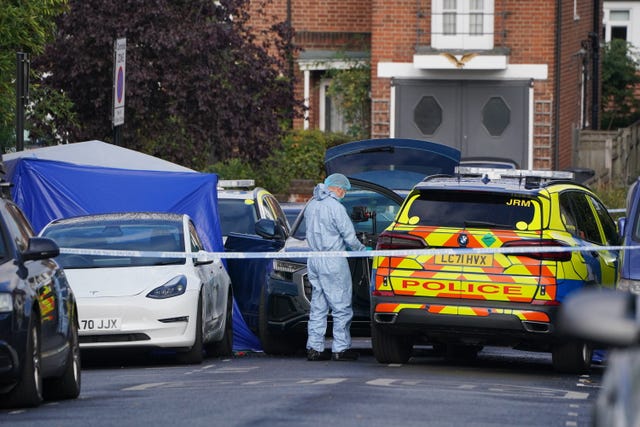 A forensics officer at the scene in Kirkstall Gardens