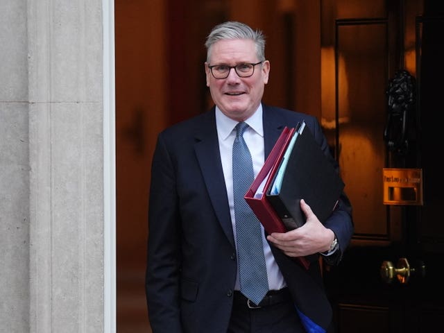 Sir Keir Starmer leaving Downing Street carrying two folders under his arm