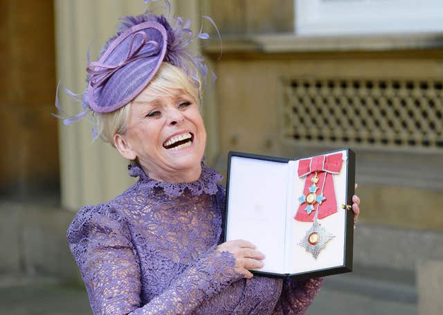 Television star Dame Barbara Windsor after she was made a Dame Commander of the order of the British Empire by Queen Elizabeth II during an Investiture ceremony at Buckingham Palace, London