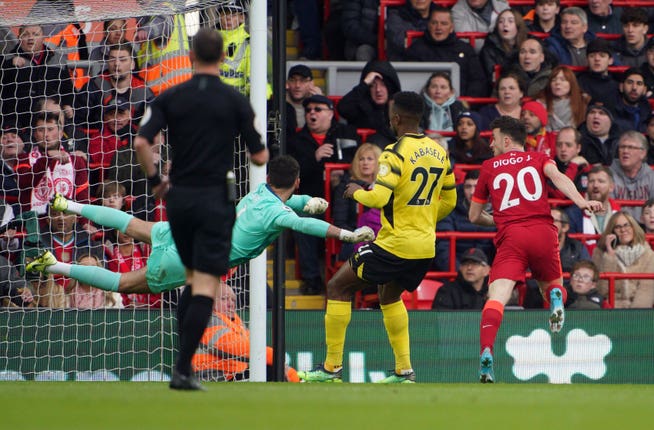 Liverpool’s Diogo Jota (right) scores the opening goal against Watford 
