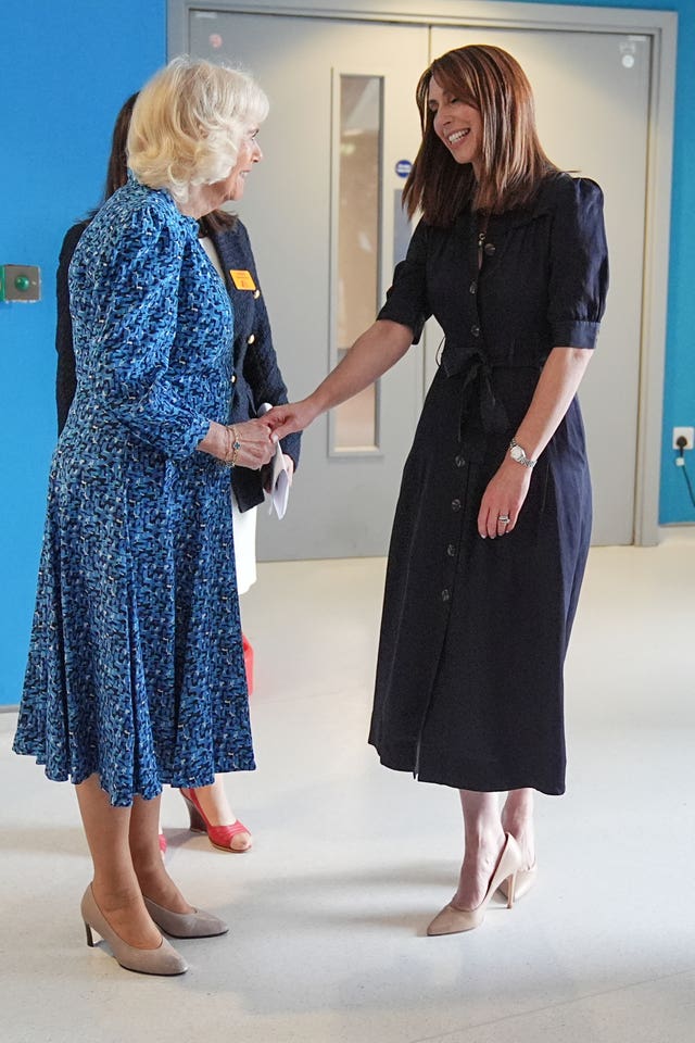 Camilla shakes hands with TV presenter Alex Jones
