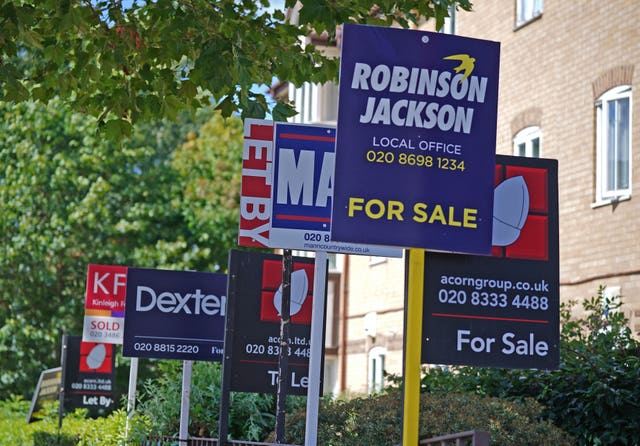 Estate agent signs outside apartments 