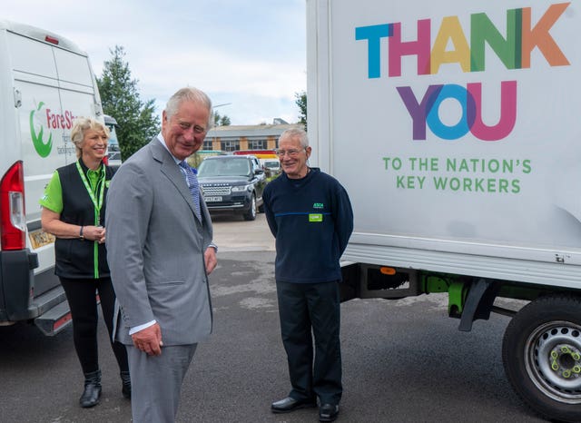 Charles with Asda staff members 