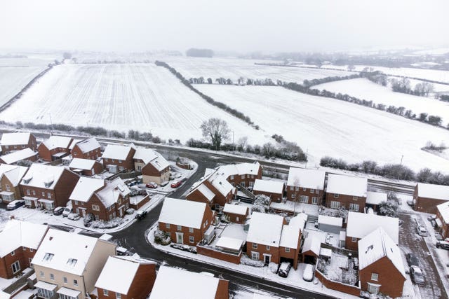 Heavy snow covers houses and fields in Burton Latimer, Northamptonshire