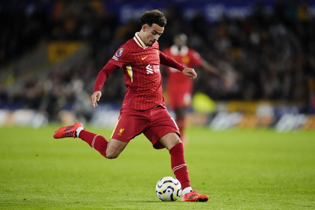 Liverpool midfielder Curtis Jones kicks the ball with his right foot