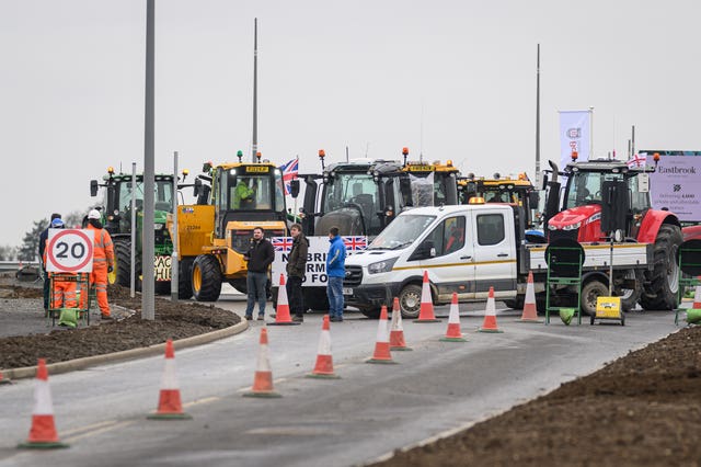 Farmers stage a demonstration during Prime Minister Sir Keir Starmer's visit to a housing development in Buckinghamshire