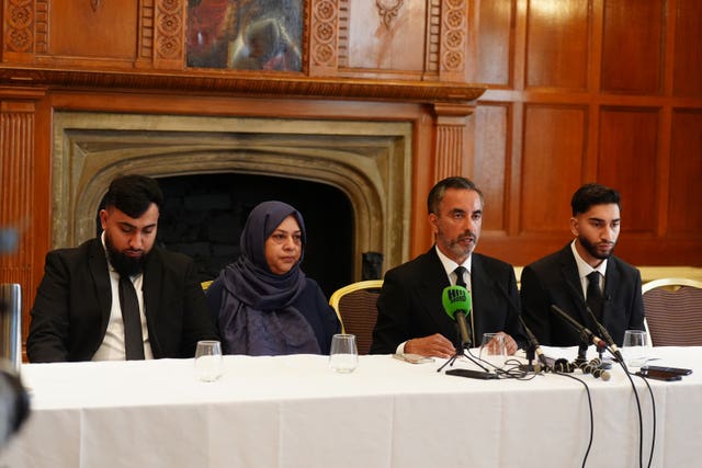 Solictor Aamer Anwar (second right) with brothers, Muhammad Amaad, 25, (left) Fahir Amaaz, 19, and thier mother Shameem Akhtar, 56, during a press conference at the Midland Hotel in Manchester in August 