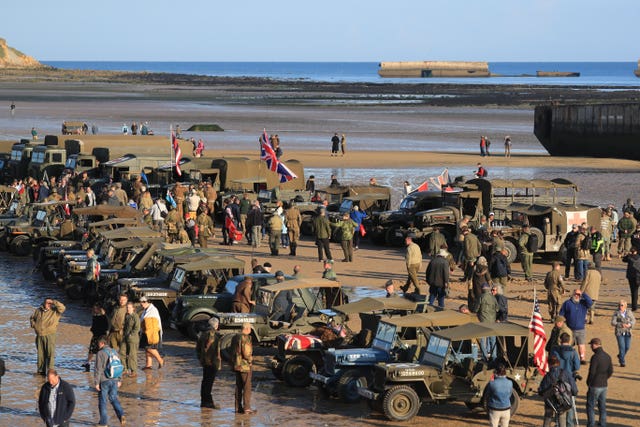 Military vehicles line the beach at Arromanches 