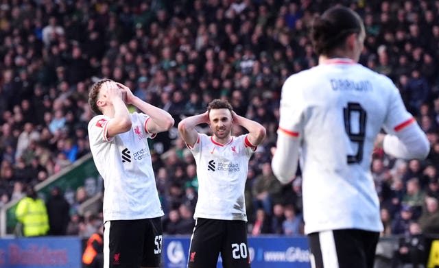 Liverpool’s James McConnell, left, reacts to a missed chance 