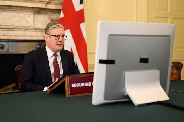 Sir Keir Starmer speaks to a virtual meeting of world leaders from the Cabinet room in 10 Downing Street