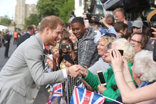Royal handshake: fans are eager to shake Harry's hand and wish him well for his wedding (Jonathan Brady/PA)