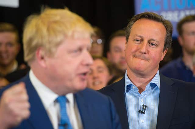 David Cameron watches as Boris Johnson speaks