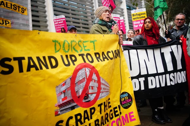 People from Extinction Rebellion and Stand Up to Racism take part in a Stop Braverman, Stop the Hate protest outside the Home Office in central London