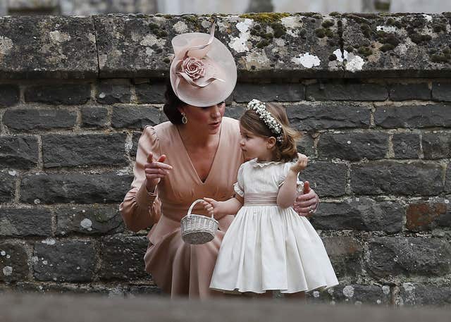 The Duchess of Cambridge with her daughter Princess Charlotte at Pippa Middleton's wedding (Kirsty Wigglesworth/PA)