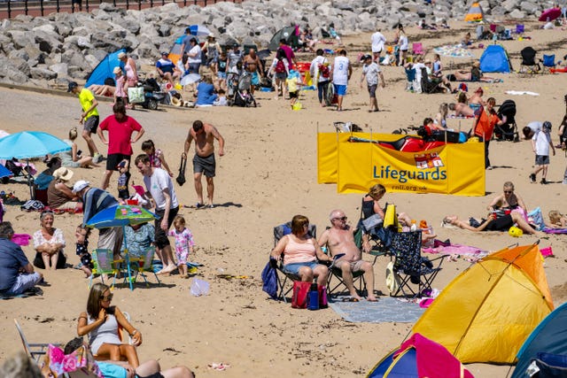 People enjoying the weather on a beach