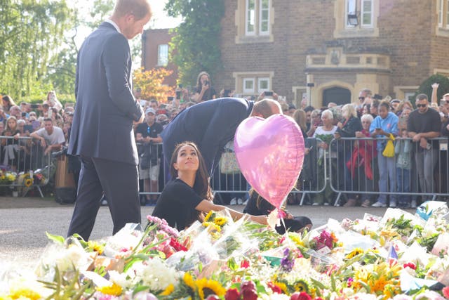 The Prince and Princess of Wales and the Duke and Duchess of Sussex viewing the messages and floral tributes left by members of the public at Windsor Castle in Berkshire