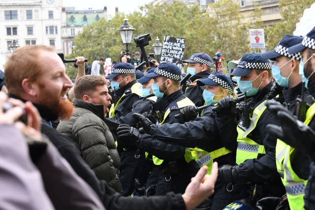 Protesters and police at a We Do Not Consent rally at Trafalgar Square in London, organised by Stop New Normal, to protest against coronavirus restrictions in September
