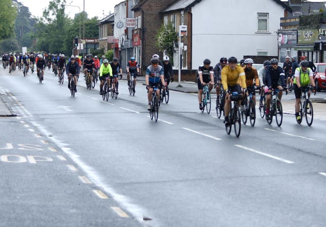 Cyclists pass through Epping town centre in Essex