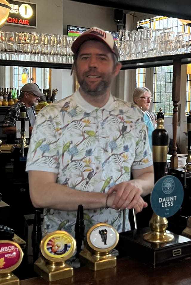 Chris French behind the bar of The Mitre in Richmond