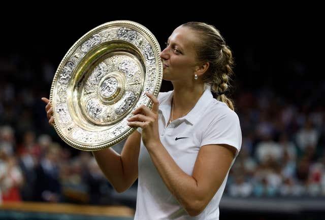 Petra Kvitova kisses the Wimbledon trophy