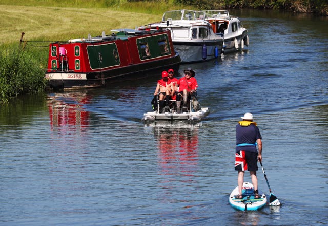 Alex Gibson, a former GB decathlete who was diagnosed with Motor Neurone Disease, has set off with his team to navigate the Thames on a pedalo and break a world record (Jonathan Brady/PA)