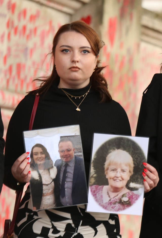 Hannah Brady with photos of Shaun and Margaret Brady, who died with Covid-19