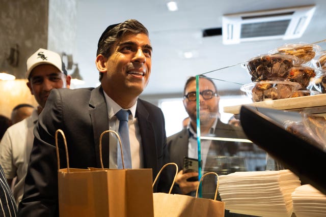 Prime Minister Rishi Sunak buys baked goods from a bakery in London