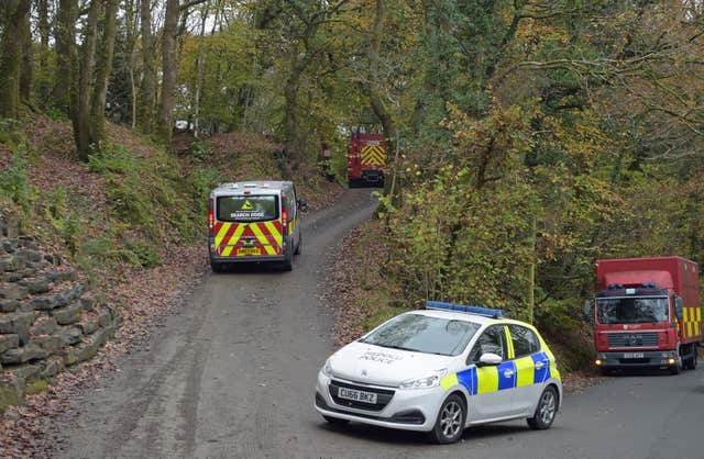 A police search dogs van drives towards the scene in Llangammarch Wells, Powys (Ben Birchall/PA)