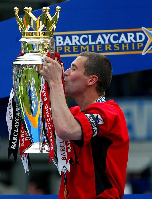 Manchester United’s Roy Keane holds the Premiership trophy
