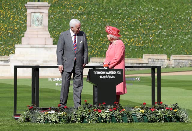 The Queen with Sir John Spurling, chairman of London Marathon Events (Chris Jackson/PA)