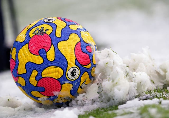 A match ball in the snow during the Premier League match at the Etihad Stadium
