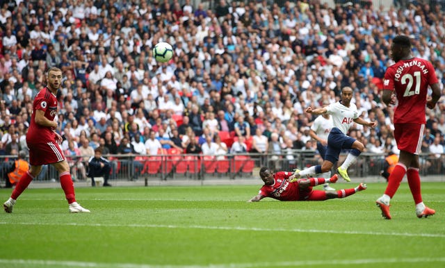 Lucas Moura, second right, scores Spurs' first goa