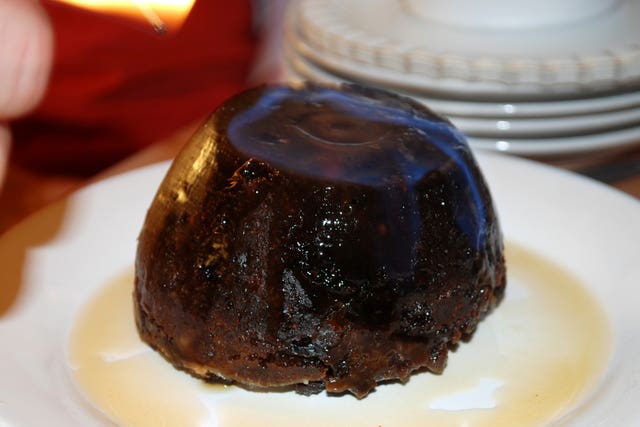 A Christmas pudding being set alight (Lewis Stickley/PA)