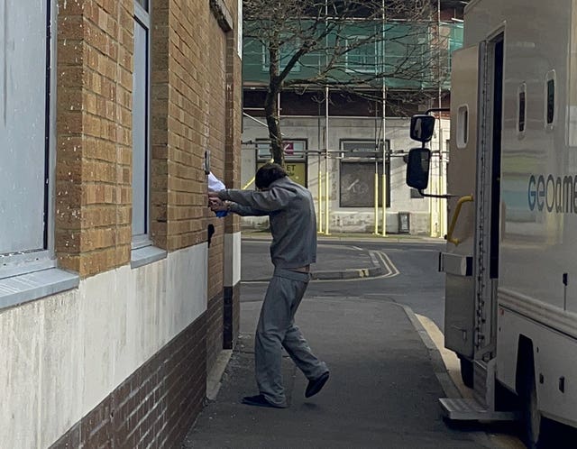 Matthew Battenbough being led into Swansea Magistrates’ Court