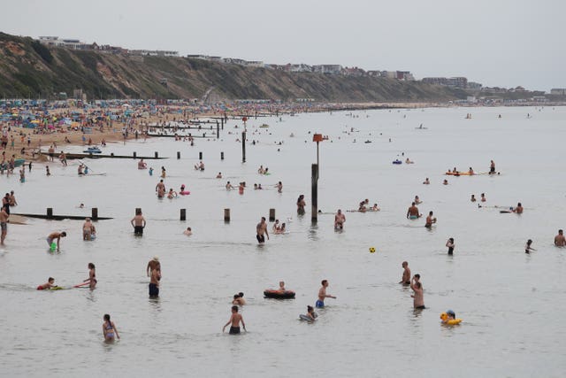 Swimming in the sea at Boscombe beach in Dorset